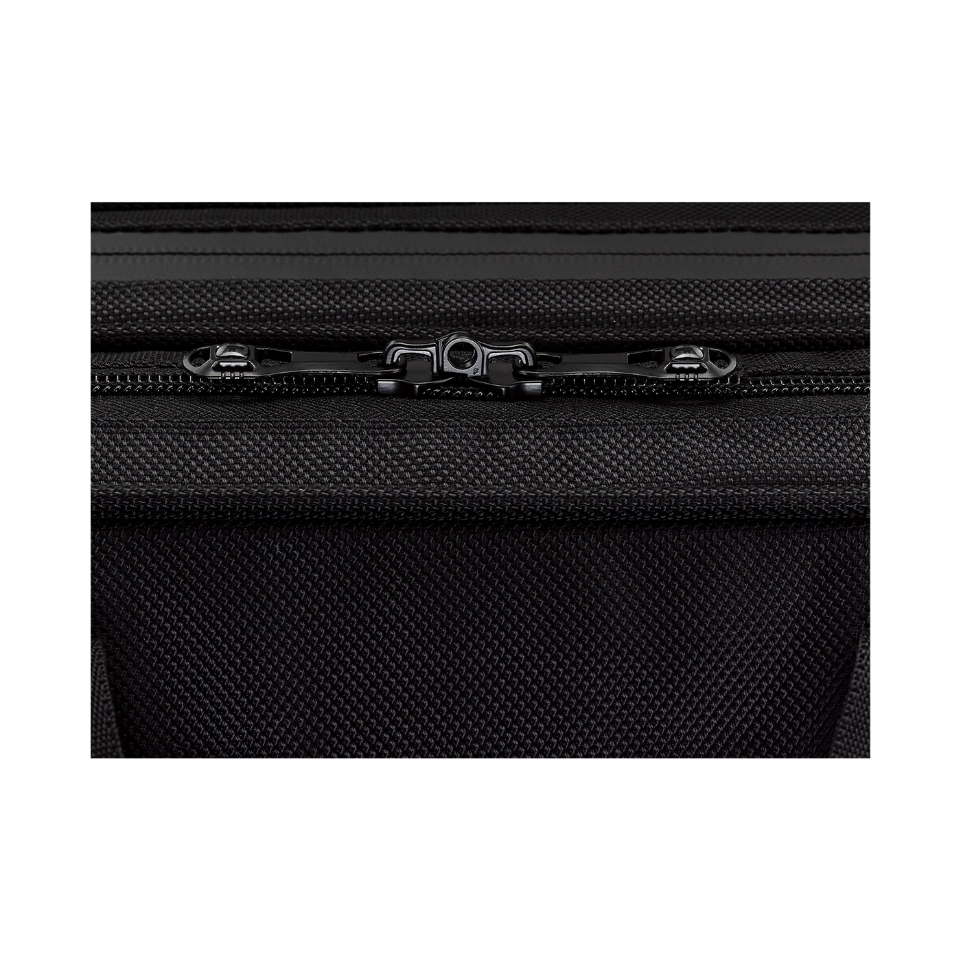 Close-up of a black zipper on black fabric, detailed texture, luggage detail