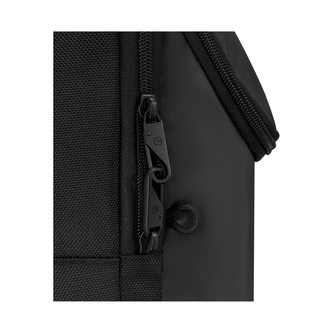 Close-up of a black zipper on a bag with a small logo
