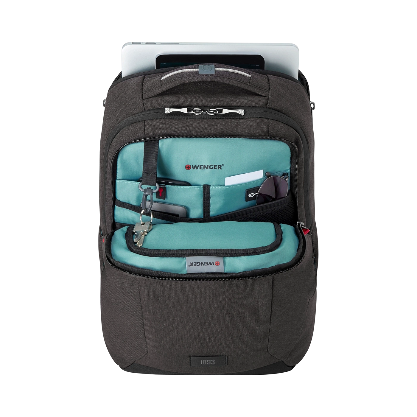 Black backpack with open compartment, tablet, and accessories visible.