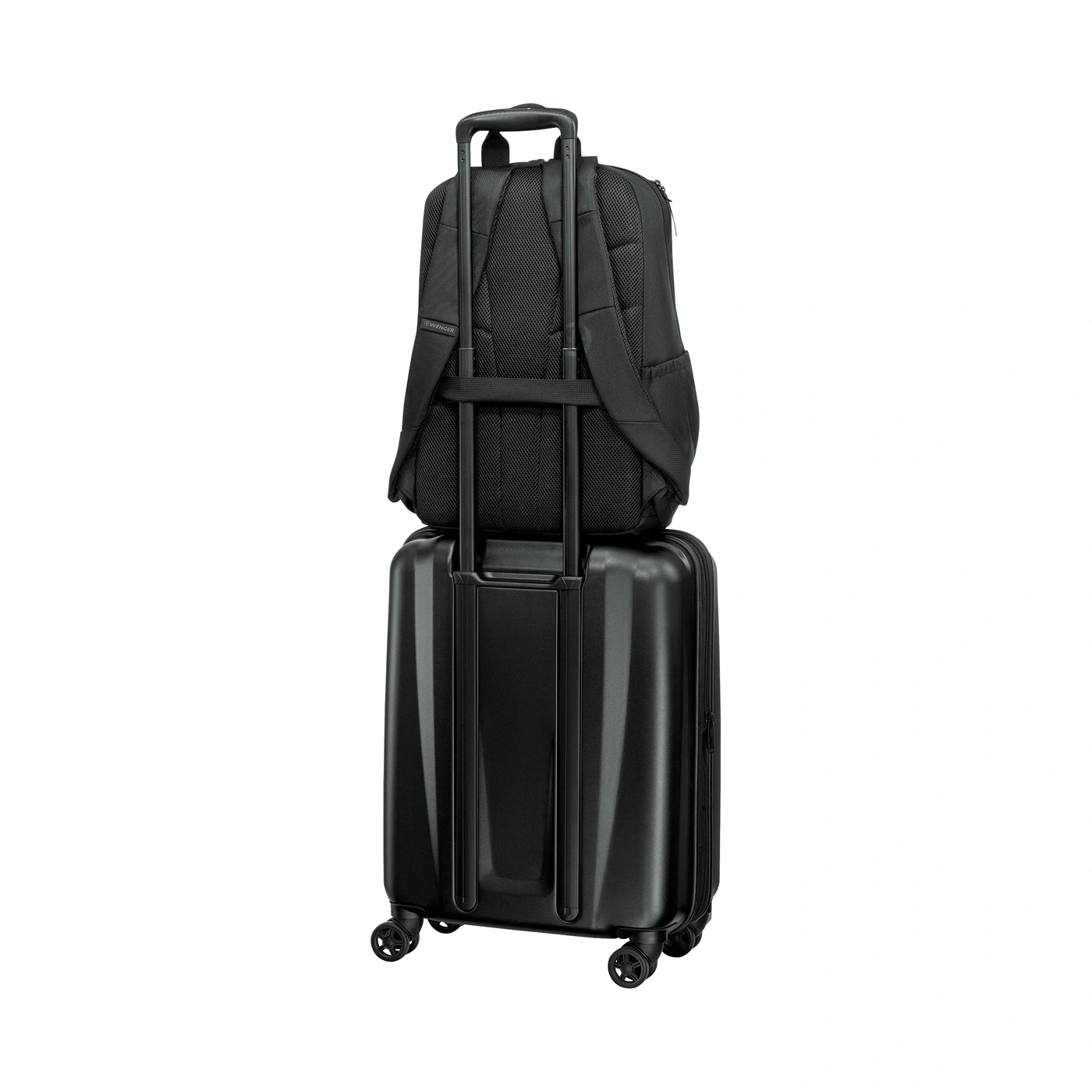 Black backpack on a black rolling suitcase
