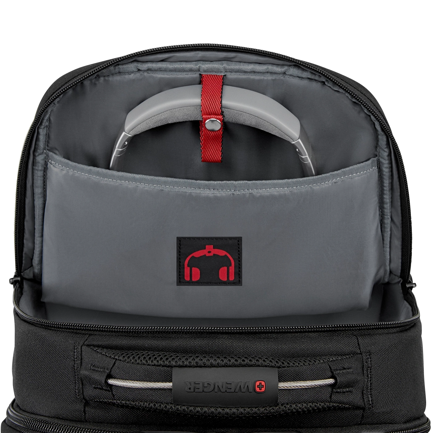 Black backpack with headphone logo and headphones inside the pocket.